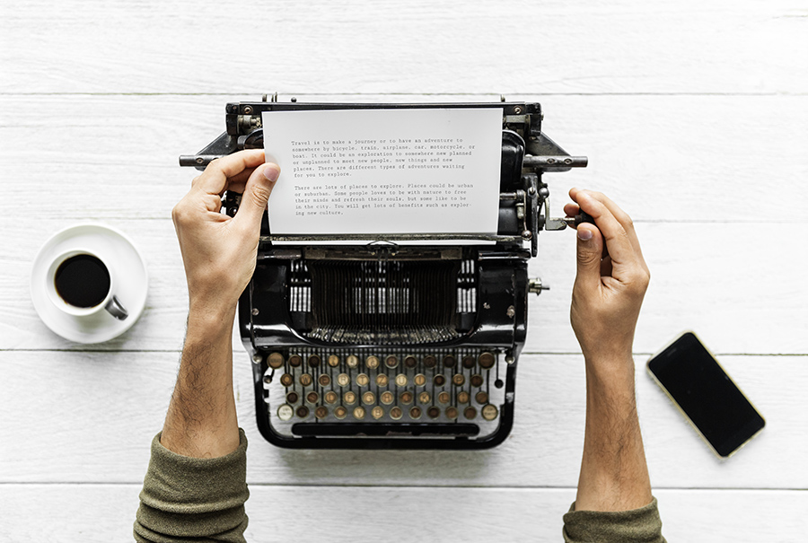 Person using a typewriter writing a subpoena