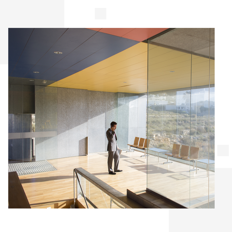 man speaking on the phone in an office